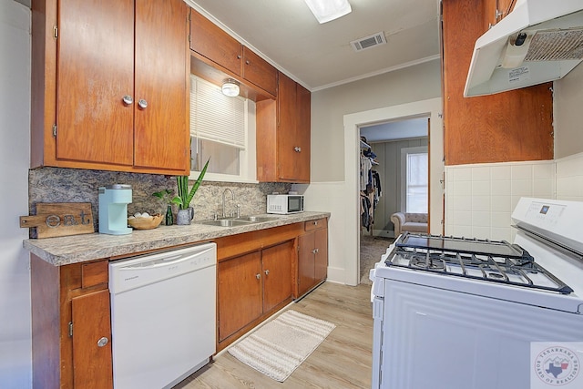 kitchen featuring light hardwood / wood-style floors, sink, white appliances, and crown molding