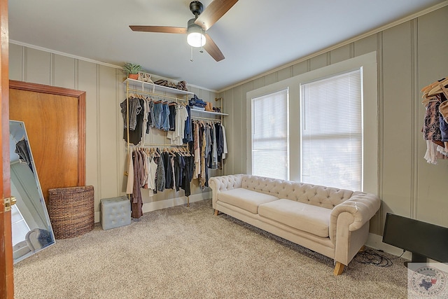 walk in closet featuring carpet floors and ceiling fan