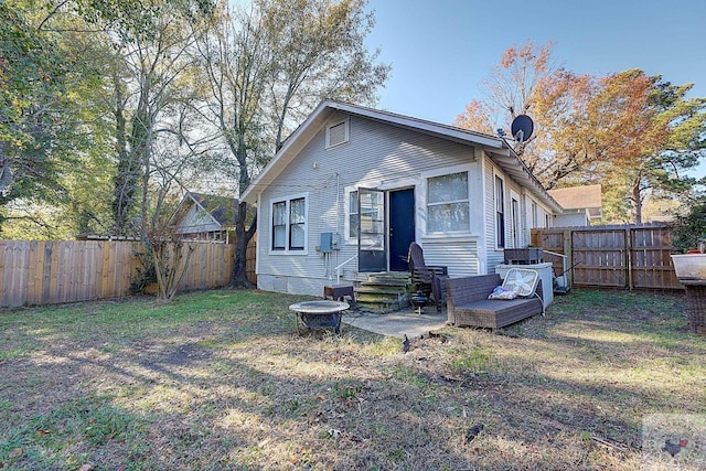 back of house with a yard