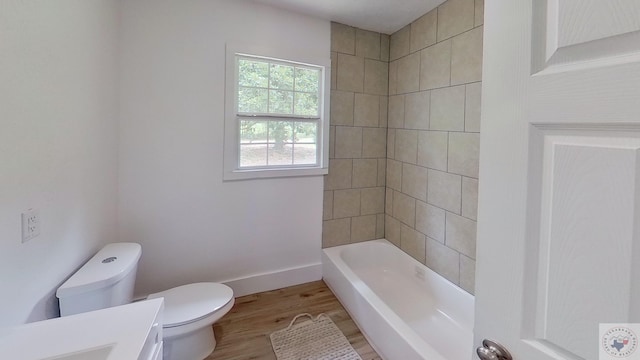 bathroom featuring vanity, toilet, and hardwood / wood-style floors