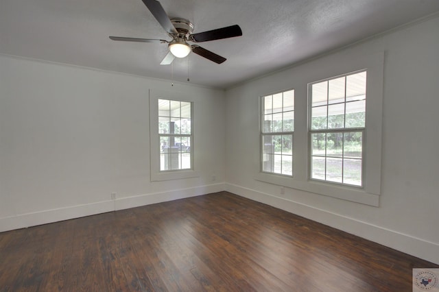 unfurnished room featuring ceiling fan, crown molding, and dark hardwood / wood-style flooring