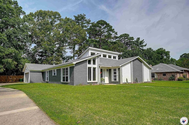 3523 Richwood Pl, Texarkana, TX 75503 - mid-century modern home with a garage, brick siding, and concrete driveway