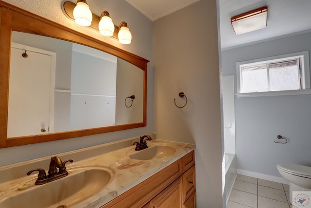 bathroom featuring crown molding, tile patterned flooring, a tub to relax in, toilet, and vanity