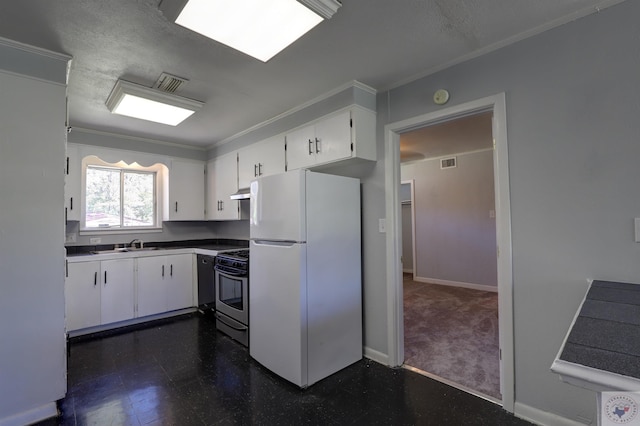 kitchen featuring white refrigerator, white cabinets, stainless steel range with gas stovetop, and ornamental molding