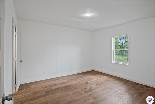 121 Circle Dr, Bogata, TX 75417 - unfurnished room featuring wood finished floors and baseboards