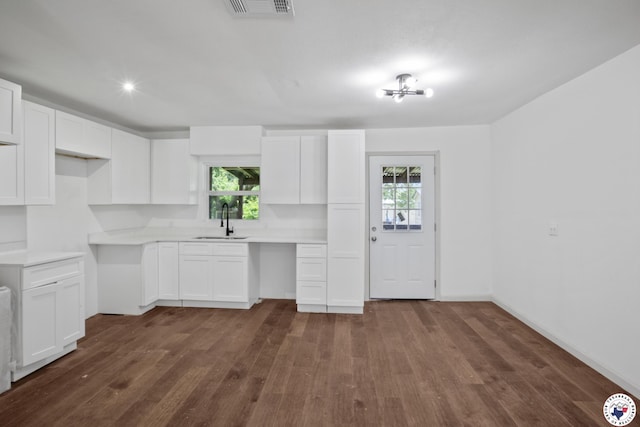 121 Circle Dr, Bogata, TX 75417 - kitchen featuring dark wood finished floors, healthy amount of natural light, light countertops, white cabinetry, and recessed lighting