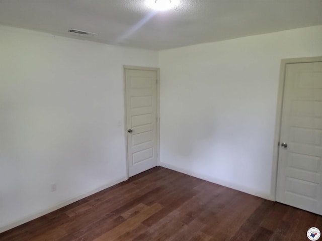 121 Circle Dr, Bogata, TX 75417 - unfurnished room with dark wood-style floors