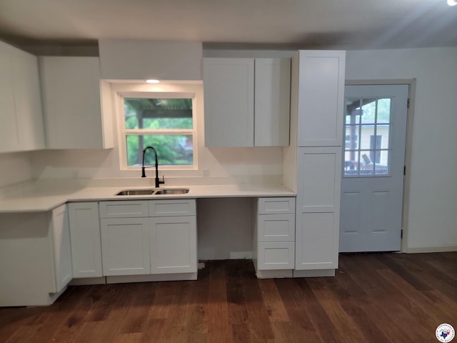 121 Circle Dr, Bogata, TX 75417 - kitchen with white cabinets, light countertops, and dark wood-type flooring