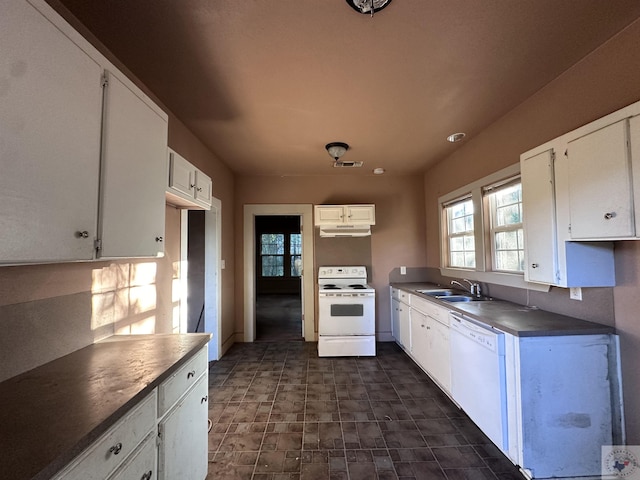 kitchen with sink, white appliances, and white cabinets