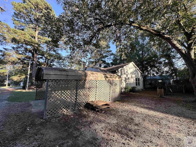 view of side of home with a carport