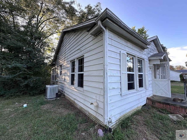 view of property exterior with central AC