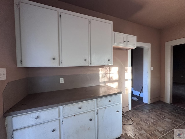 kitchen featuring white cabinets