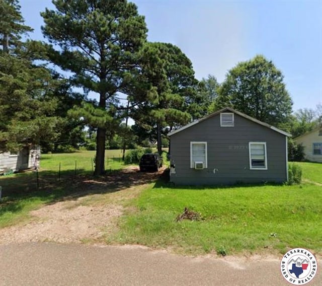1018 Plum St, Texarkana, TX 75501 - view of side of home featuring a yard
