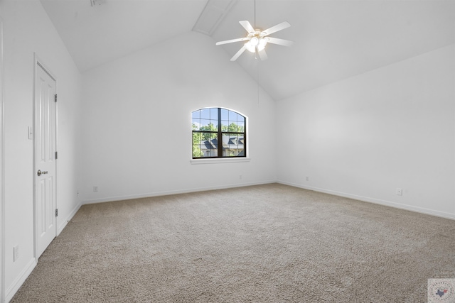 carpeted spare room featuring high vaulted ceiling, beamed ceiling, and ceiling fan