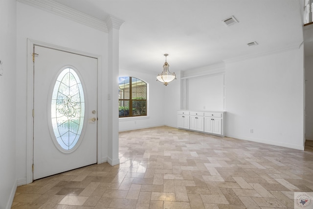 entrance foyer featuring ornamental molding