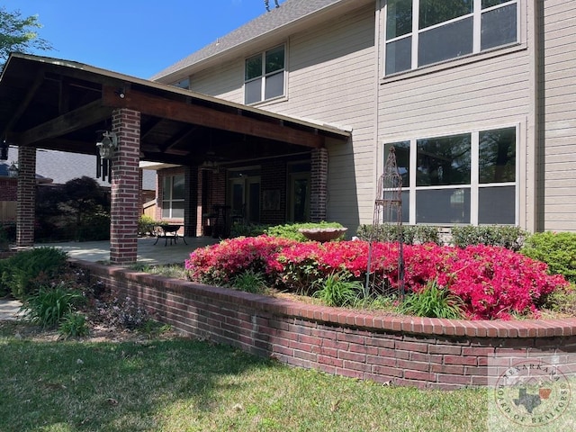 back of property featuring a patio