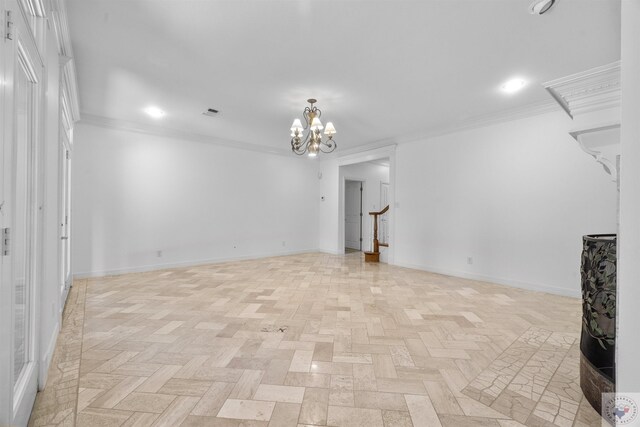 unfurnished living room with baseboards, a chandelier, and crown molding