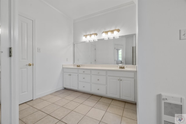 bathroom with tile patterned floors, heating unit, ornamental molding, and vanity