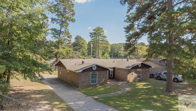 ranch-style home featuring a front yard