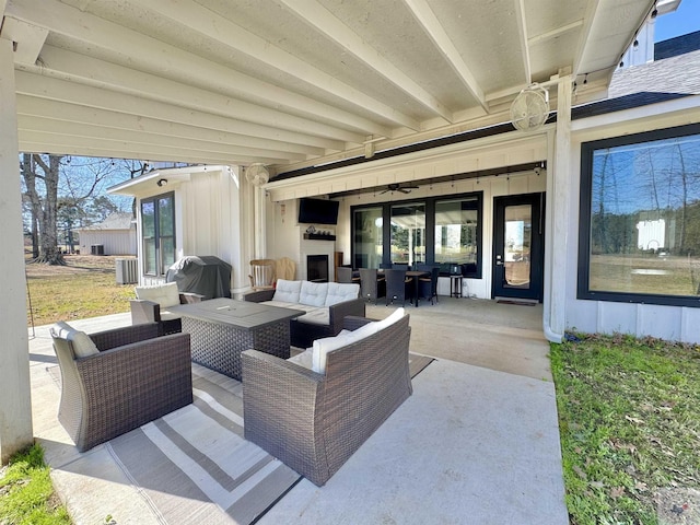 view of patio with central AC unit, a grill, and outdoor lounge area