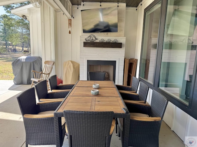 view of patio / terrace with outdoor dining area and a grill