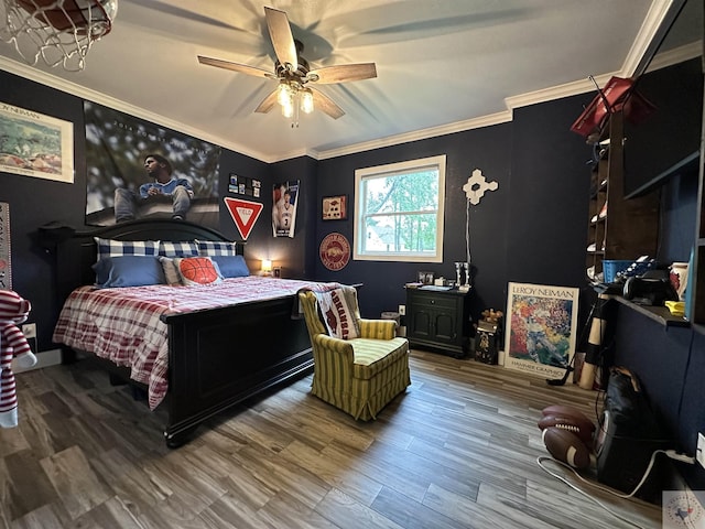 bedroom with ceiling fan, wood finished floors, and crown molding