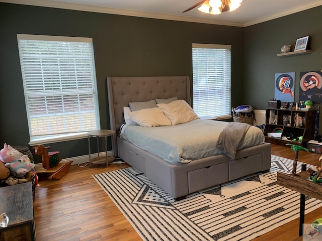 809 N Louise St, Atlanta, TX 75551 - bedroom with ornamental molding, baseboards, and wood finished floors