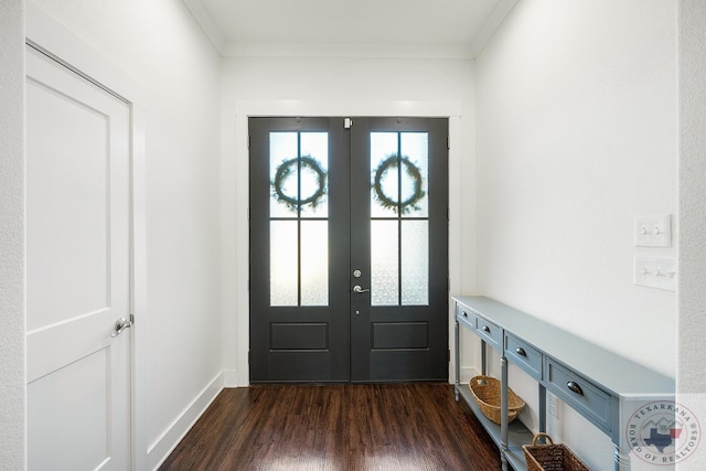 entrance foyer featuring ornamental molding, french doors, dark wood finished floors, and baseboards