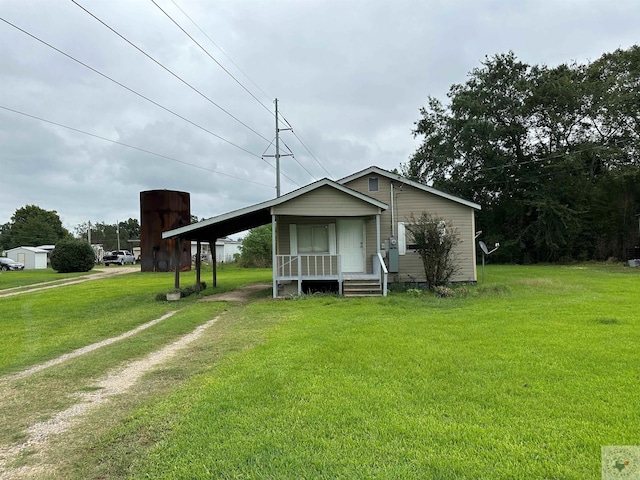 view of front of house with a porch and a front lawn