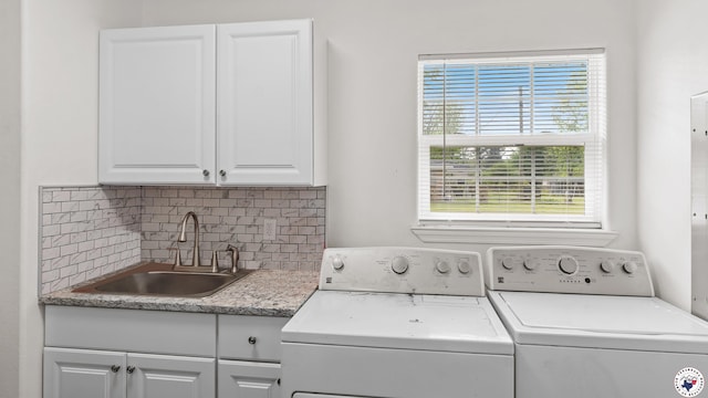 2401 E E Ave B, Hooks, TX 75561 - clothes washing area featuring cabinet space and independent washer and dryer
