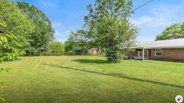 view of yard with french doors