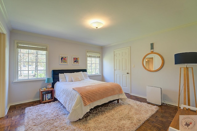 bedroom with crown molding and dark parquet floors