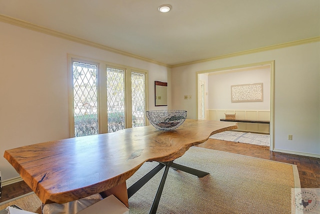 dining space featuring crown molding and dark parquet floors