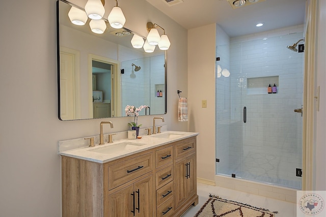 bathroom featuring walk in shower and vanity