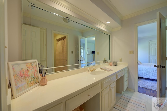 bathroom with crown molding and vanity