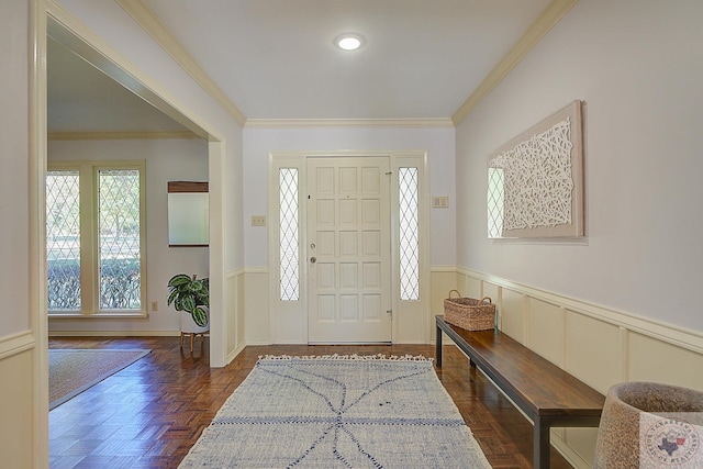 foyer featuring crown molding and dark parquet flooring