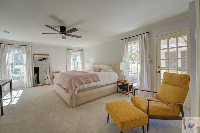 carpeted bedroom with crown molding, ceiling fan, and multiple windows