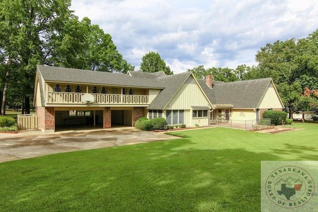 rear view of house with a lawn