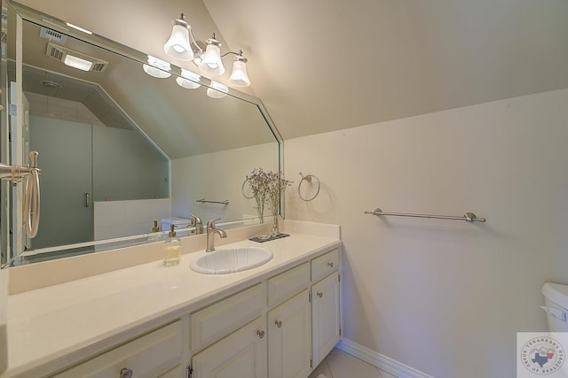 bathroom featuring lofted ceiling and vanity