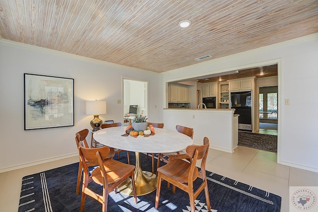 dining area featuring wood ceiling and light tile patterned flooring