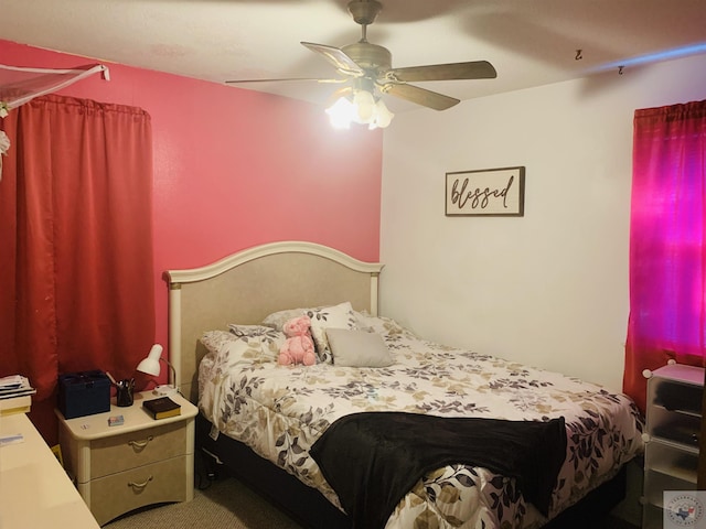 bedroom with ceiling fan and carpet