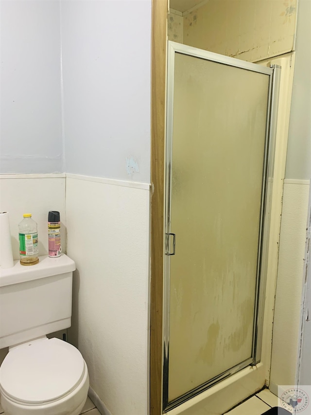 bathroom with toilet and walk in shower