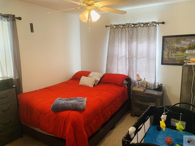 bedroom featuring ceiling fan and carpet floors