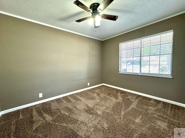 carpeted empty room with plenty of natural light, a textured ceiling, ceiling fan, and ornamental molding