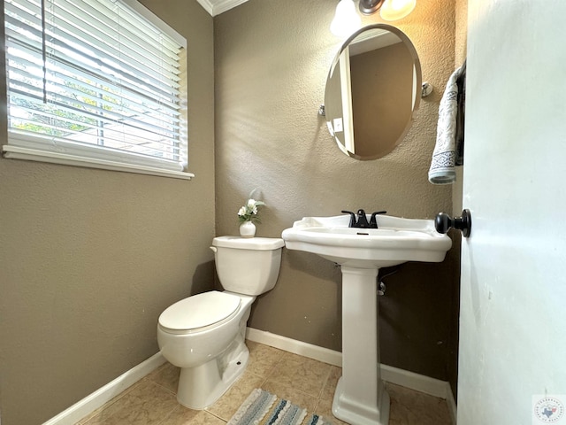 bathroom with tile patterned floors and toilet