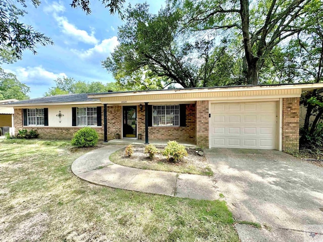 ranch-style home with a garage and a front yard