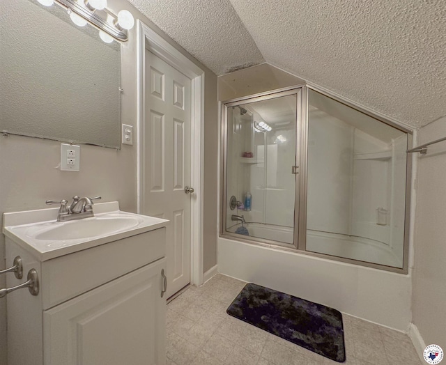 15 Annadale Dr, Maud, TX 75567 - full bath with a textured ceiling, lofted ceiling, vanity, baseboards, and combined bath / shower with glass door