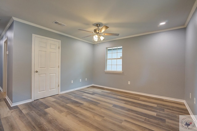 unfurnished room with ceiling fan, wood-type flooring, and crown molding