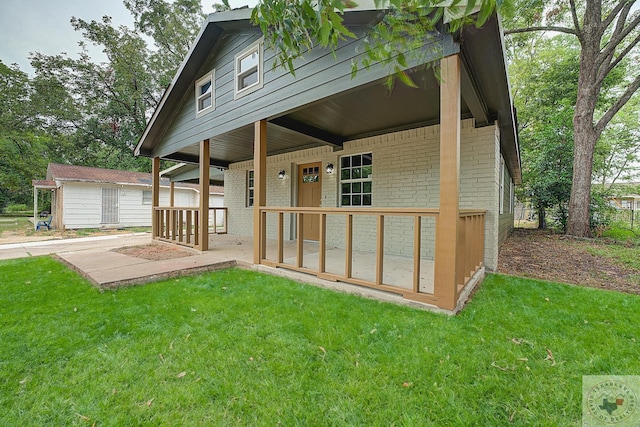 exterior space featuring an outbuilding and a lawn