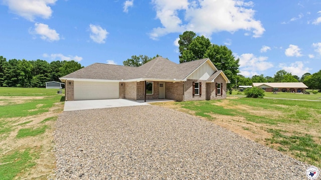 206 Spencer St, Maud, TX 75567 - single story home featuring driveway, brick siding, a garage, board and batten siding, and a front lawn